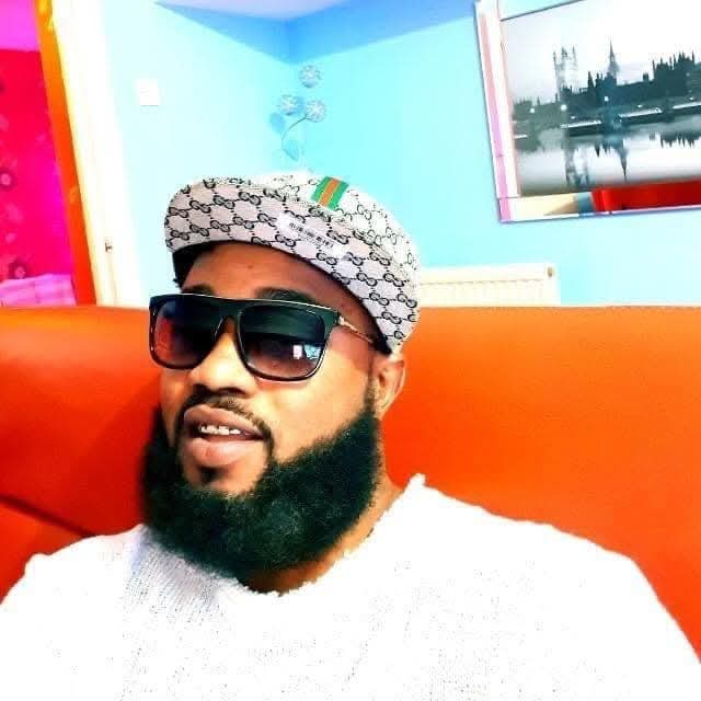 CJ in the shop, cap and sunglasses